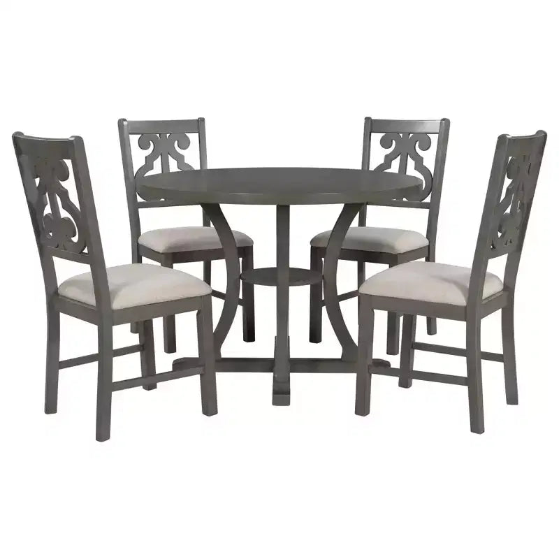 Set da pranzo da 5 pezzi con tavolo rotondo in legno e sedie con gambe dalla forma particolare e schienale traforato dal design raffinato per cucina