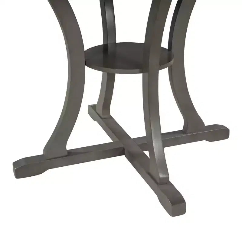 Set da pranzo da 5 pezzi con tavolo rotondo in legno e sedie con gambe dalla forma particolare e schienale traforato dal design raffinato per cucina