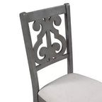 Set da pranzo da 5 pezzi con tavolo rotondo in legno e sedie con gambe dalla forma particolare e schienale traforato dal design raffinato per cucina
