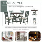Set da pranzo da 5 pezzi con tavolo rotondo in legno e sedie con gambe dalla forma particolare e schienale traforato dal design raffinato per cucina
