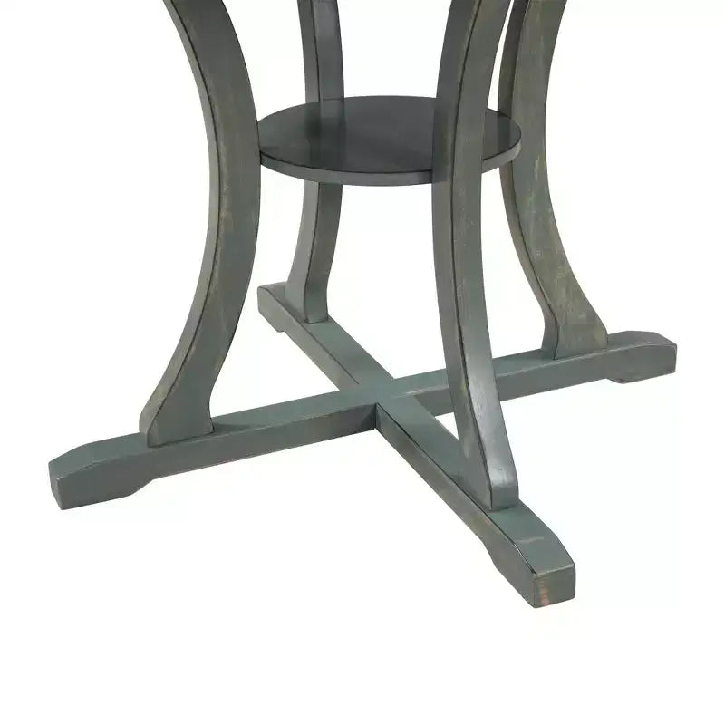 Set da pranzo da 5 pezzi con tavolo rotondo in legno e sedie con gambe dalla forma particolare e schienale traforato dal design raffinato per cucina