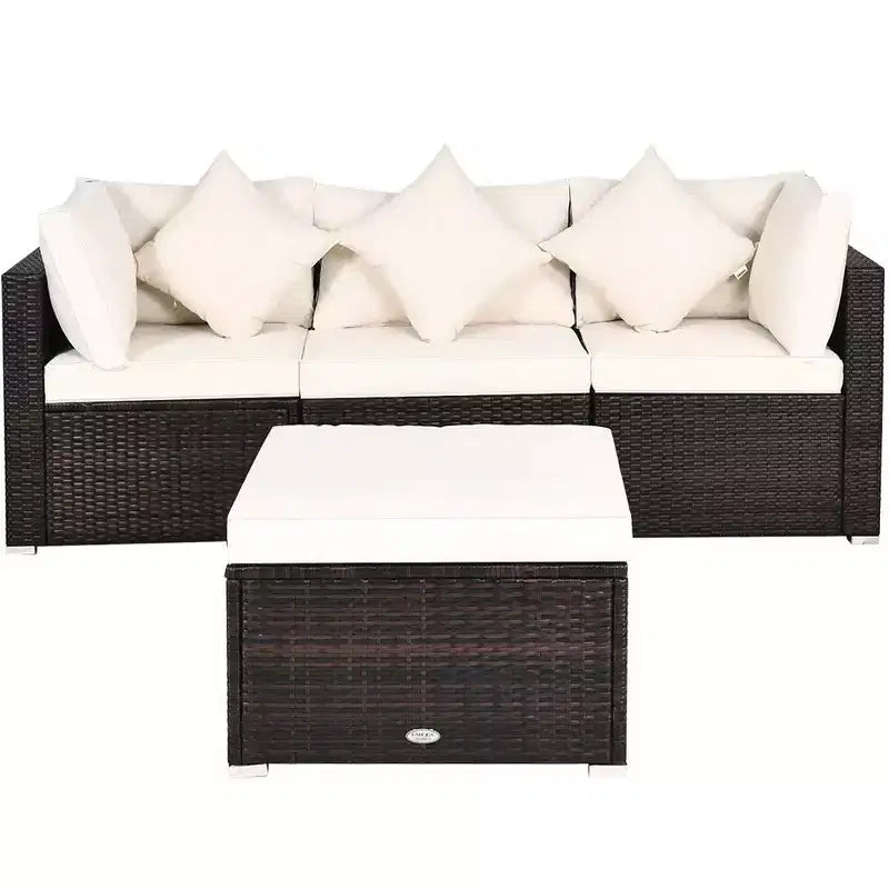 Set di mobili da giardino Costway in rattan composto da 4 pezzi, divano con cuscini e pouf