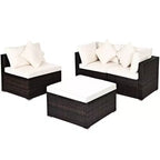 Set di mobili da giardino Costway in rattan composto da 4 pezzi, divano con cuscini e pouf