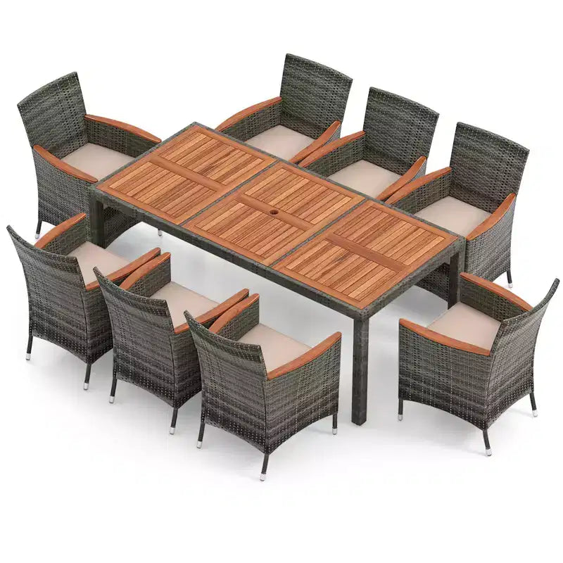 Set da pranzo per patio Costway 9 pezzi in rattan, colore grigio misto, tavolo in legno di acacia e sedie con cuscini