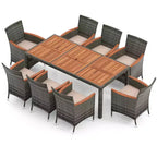 Set da pranzo per patio Costway 9 pezzi in rattan, colore grigio misto, tavolo in legno di acacia e sedie con cuscini
