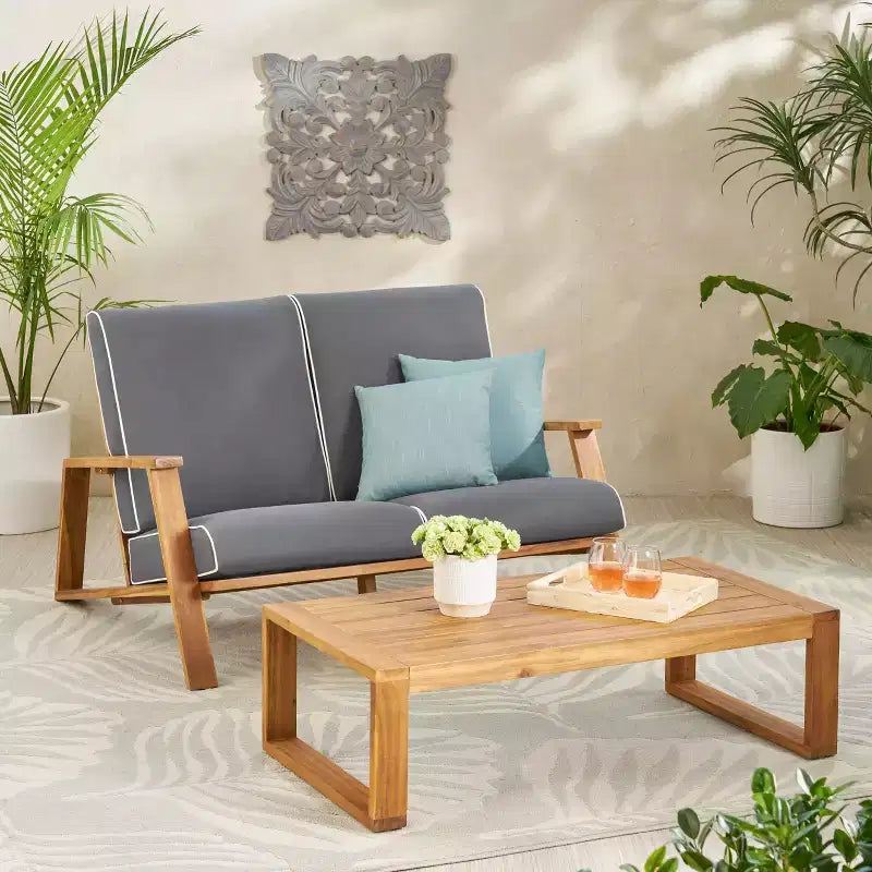 Set divanetto e tavolino da esterno in legno di acacia con cuscini Paloma di Christopher Knight Home